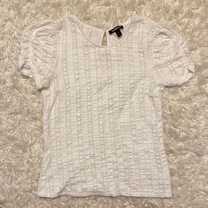 Short sleeve white blouse with slight puff sleeves. Size small. Brand - Express.